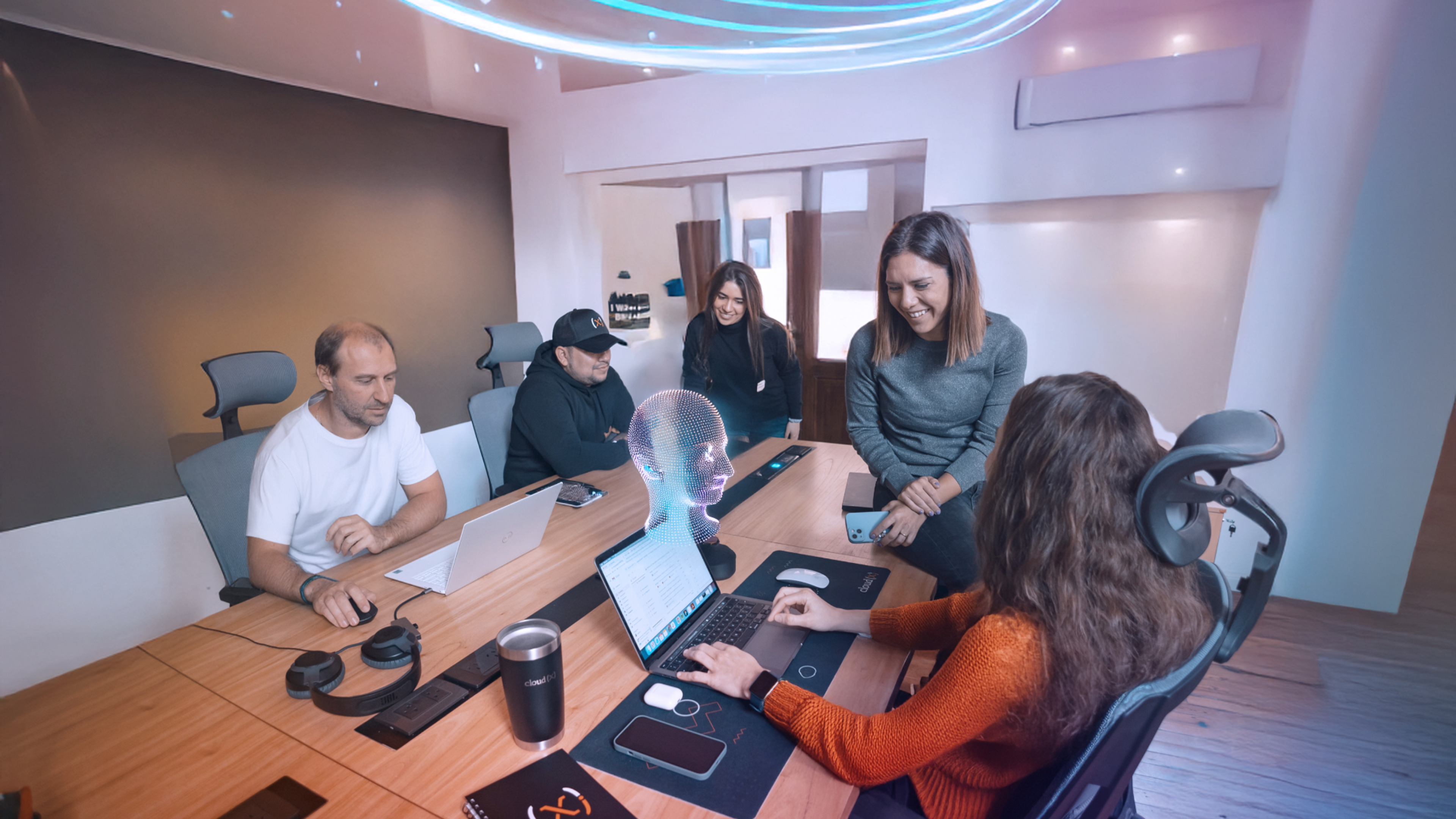 The CloudX team working on an AI project