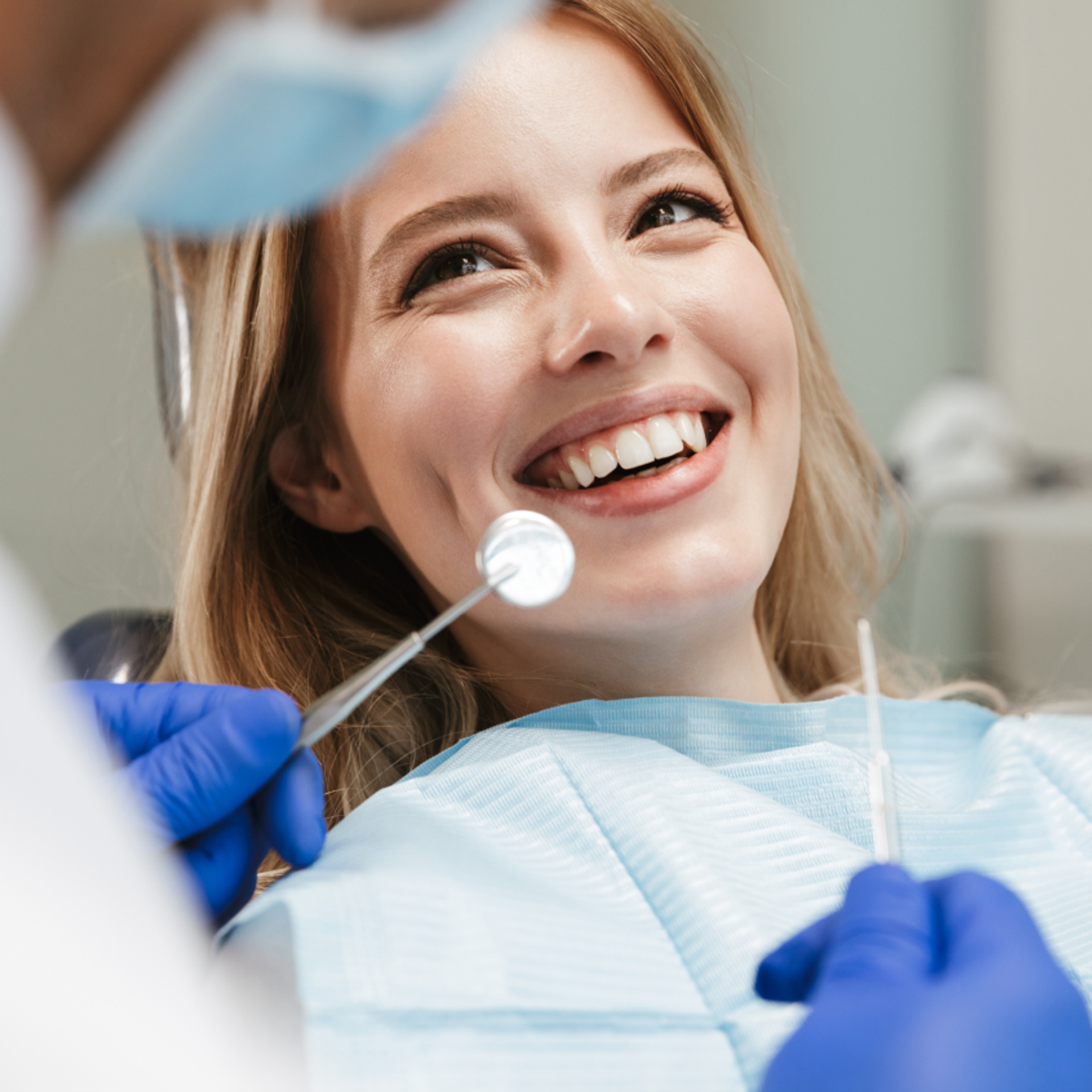 Smiling woman in a dentist chair