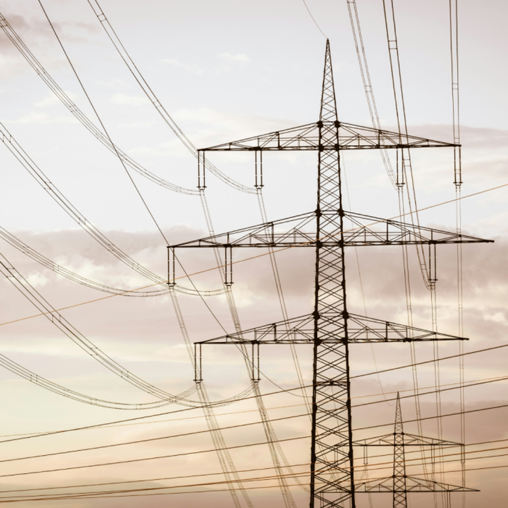 Electrical transmission towers and power lines representing energy infrastructure