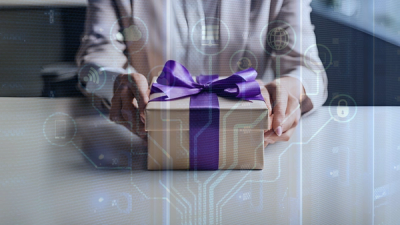 Employee receiving a gift box with digital elements on top