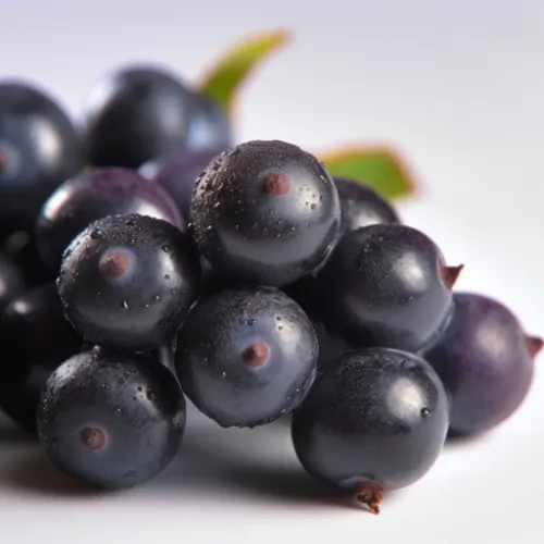 image of a cluster of acai berries with condensation droplets