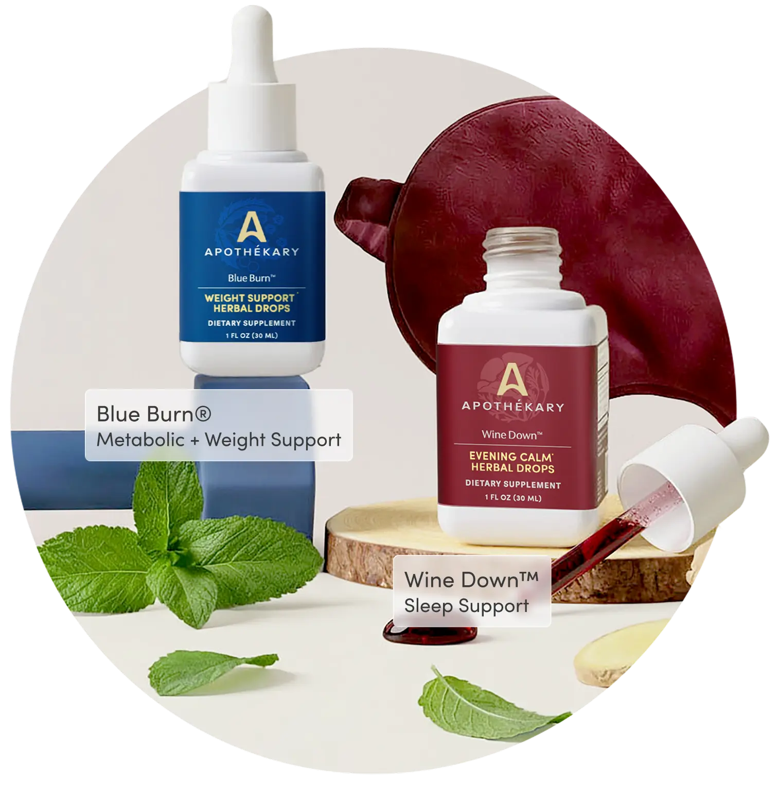 Bottles of Apothékary Blue Burn® and Wine Down™ herbal drops displayed together with fresh mint leaves, and a ginger root.