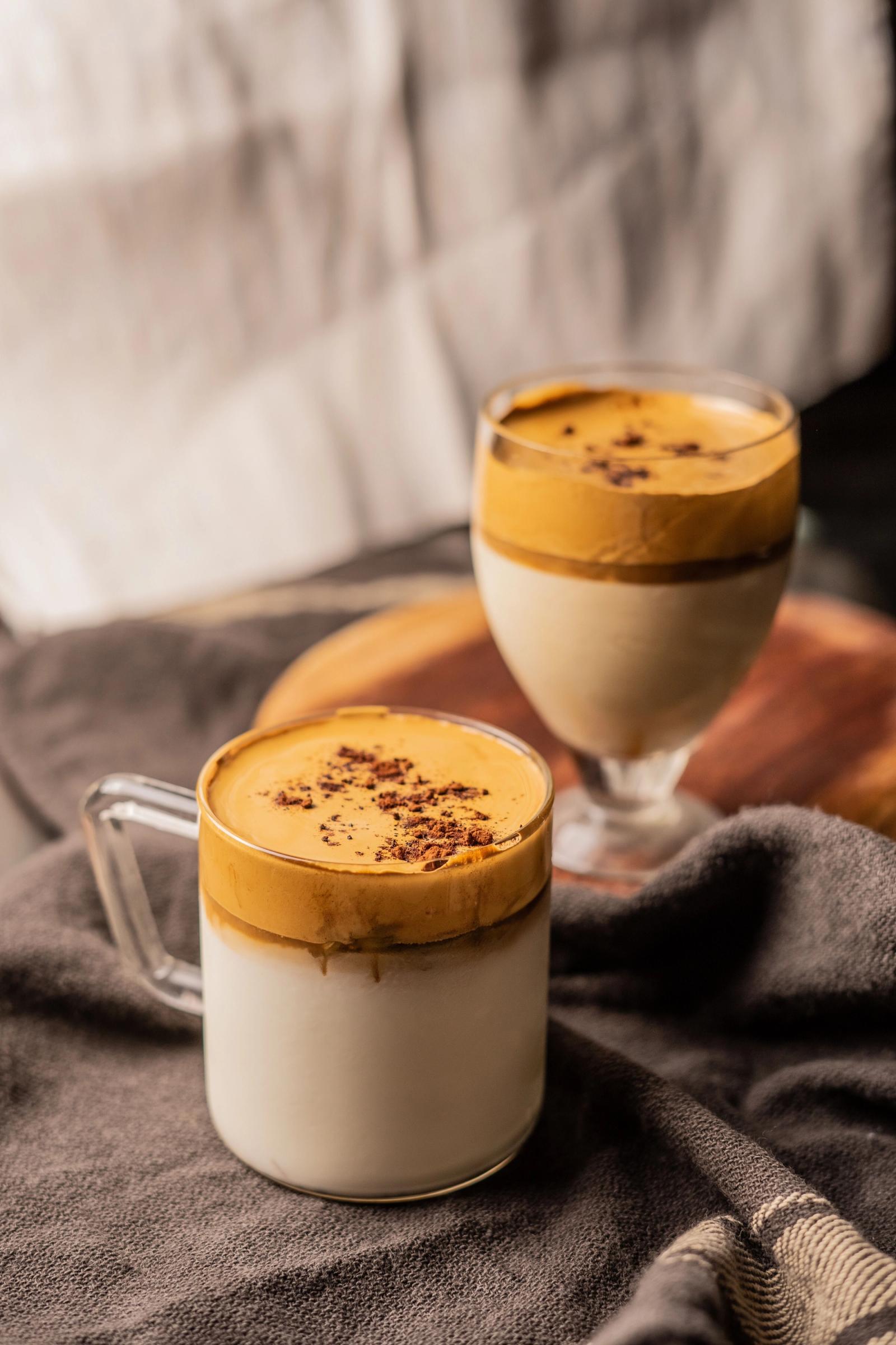 golden milk lattes in clear glasses