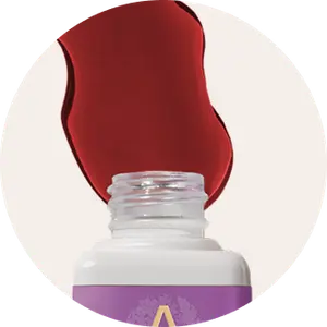 Every Phase™ open bottle spilling liquid drops