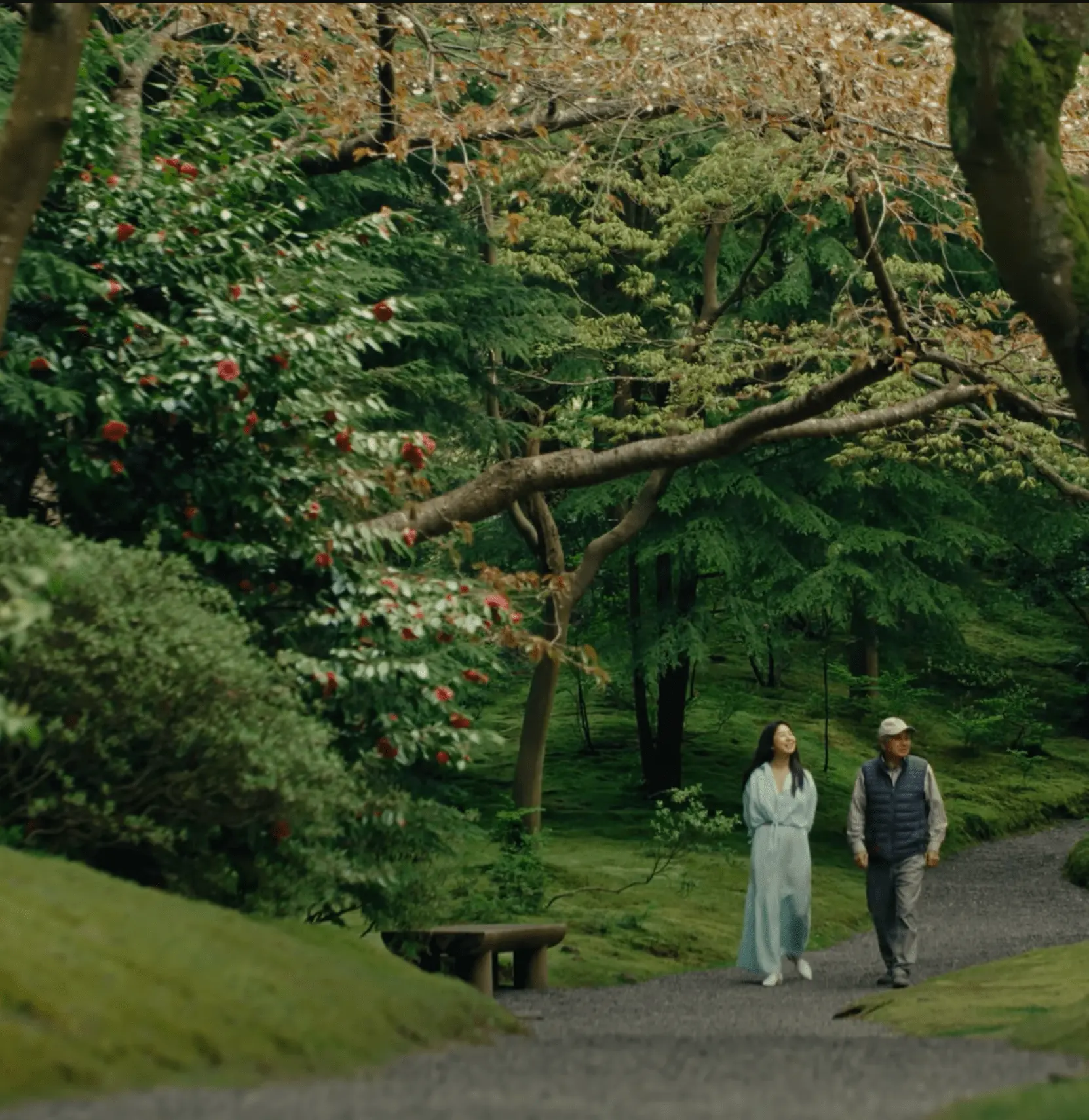 image of shizu and her father walking in a park