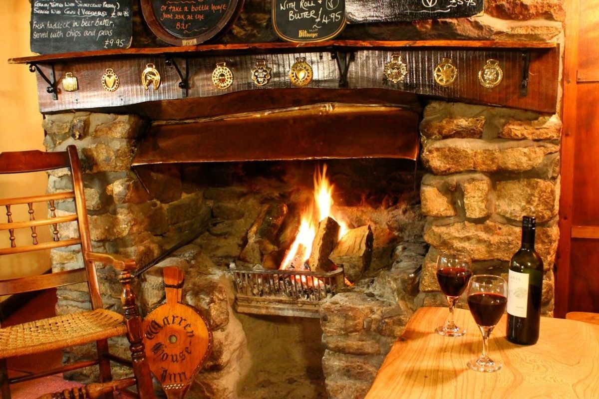 The cosy open fire of Warren House Inn, a dog-friendly pub in Devon