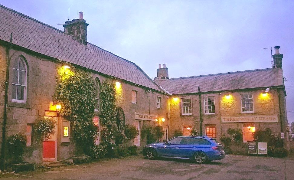 The lovely country exterior of The Three Wheat Heads, a dog-friendly pub in Northumberland