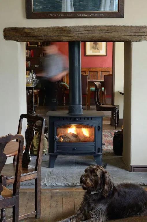 The cosy woodburner at The Cuckoo Brow Inn in the Lake District, a dog-friendly pub in the Lake District
