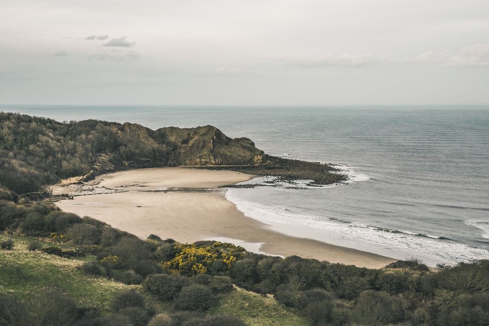 The beautiful coastline of Cayton Bay, one of the UK's best beaches in North Yorkshire