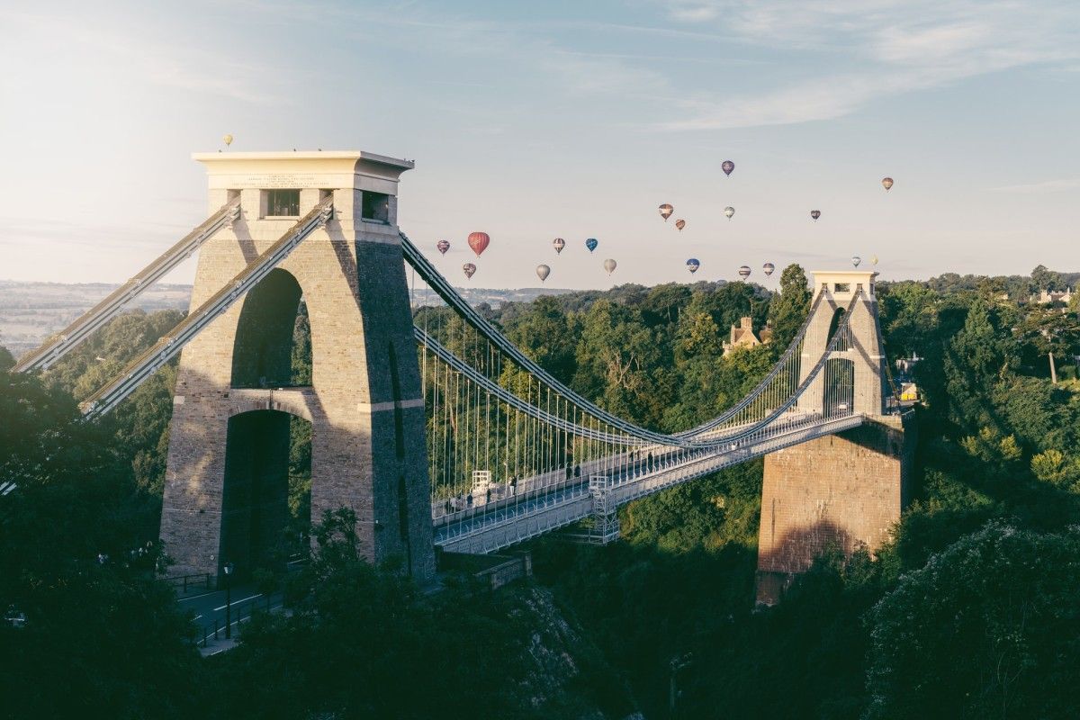 Hot air balloons over the iconic Clifton Suspension Bridge in Bristol, a fantastic dog-friendly destination at Dog Friendly Cottages