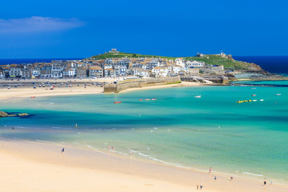 The iconic harbour of st ives seen from the sea, one of Snaptrips best towns to visit in Cornwall
