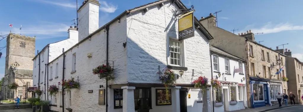 The exterior of the Sun Inn, a dog-friendly pub in the Lake District