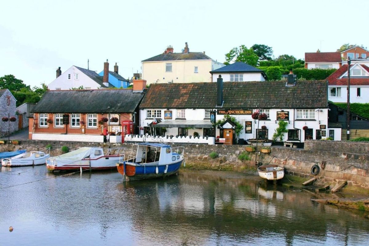 The exterior of The Anchor Inn next to the waterfront, one of Devon's best dog-friendly pubs
