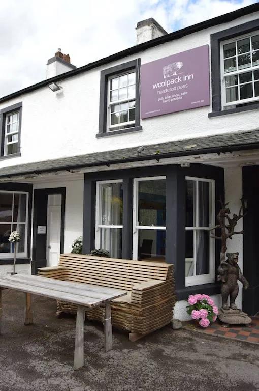 The exterior of the Woolpack Inn, a dog-friendly pub in the Lake District