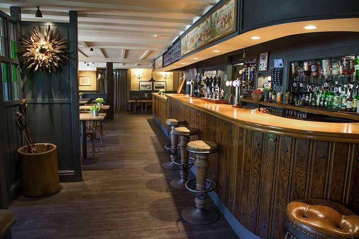The modern bar area of The Village Inn, a dog-friendly pub in Devon