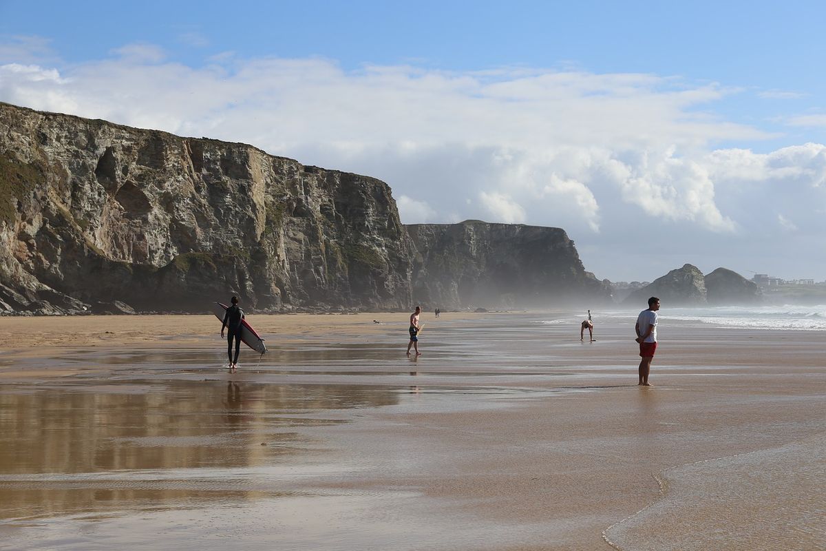 Surfers and beach-goers enjoy Watergate Bay, a dog-friendly beach in Cornwall