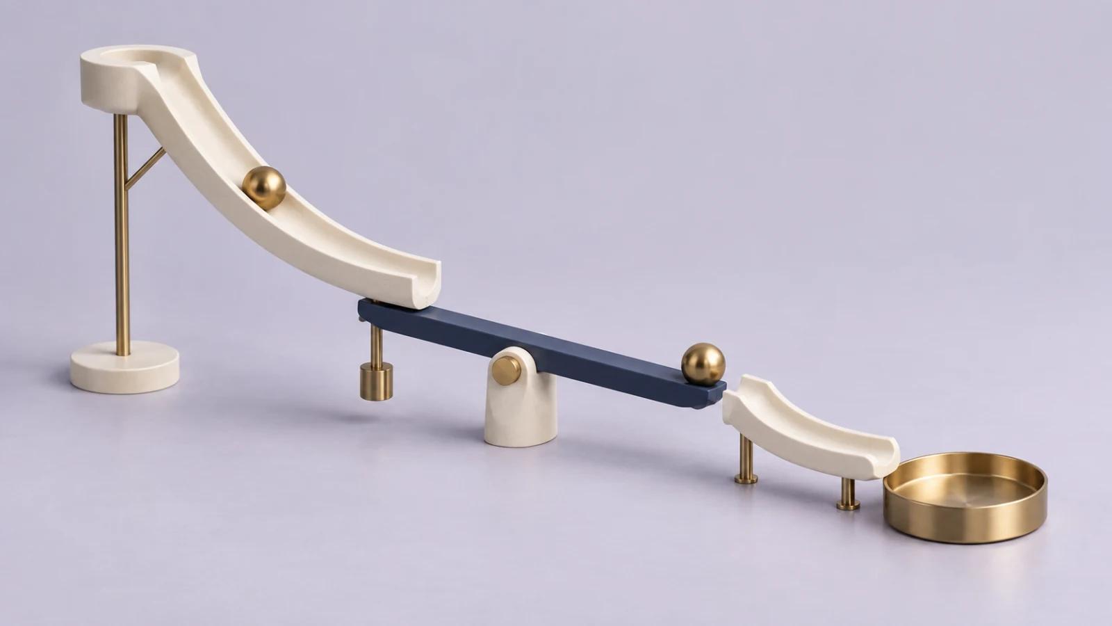 A minimal Rube Goldberg sculpture with ivory ramps, a blue lever and brass marbles on a pale lavender surface.