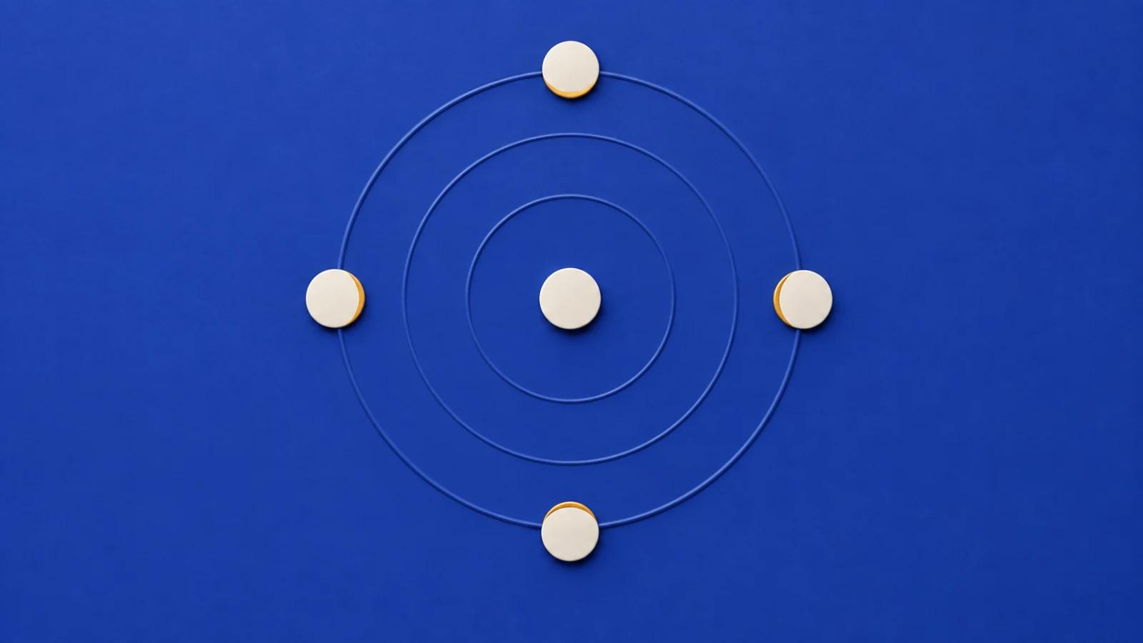 Concentric ripples from a central ivory disc reach four evenly spaced discs on a matte blue surface.