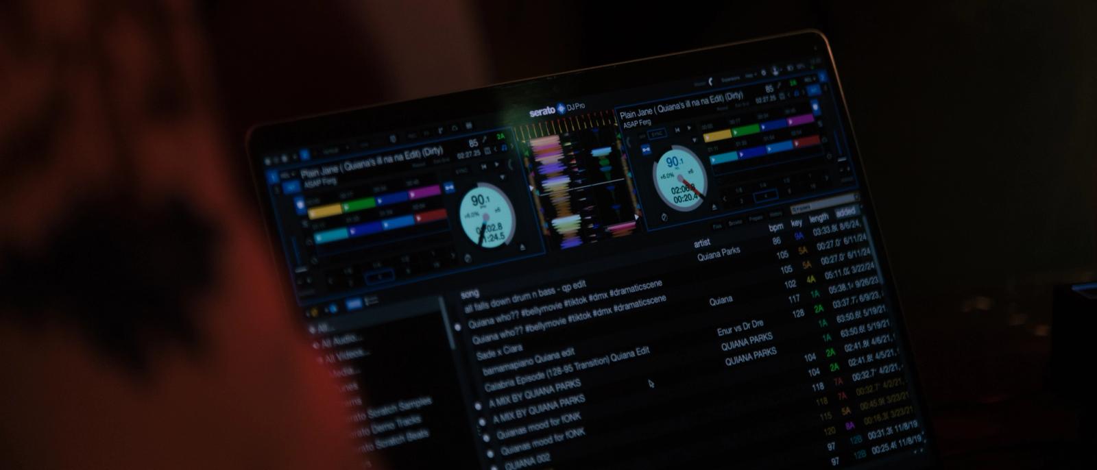 Serato DJ Pro GUI showing a two-deck layout and music library in professional DJ software.