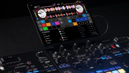 Serato DJ for iOS running on an iPad connected to DJ hardware.