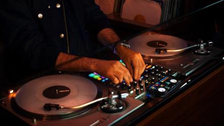 A-TRACK using Serato DJ for iOS with turntables and a mixer.