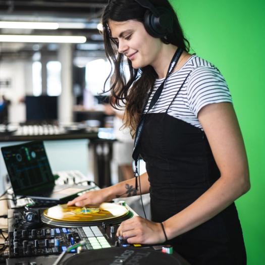A woman testing DJ software at Serato's HQ