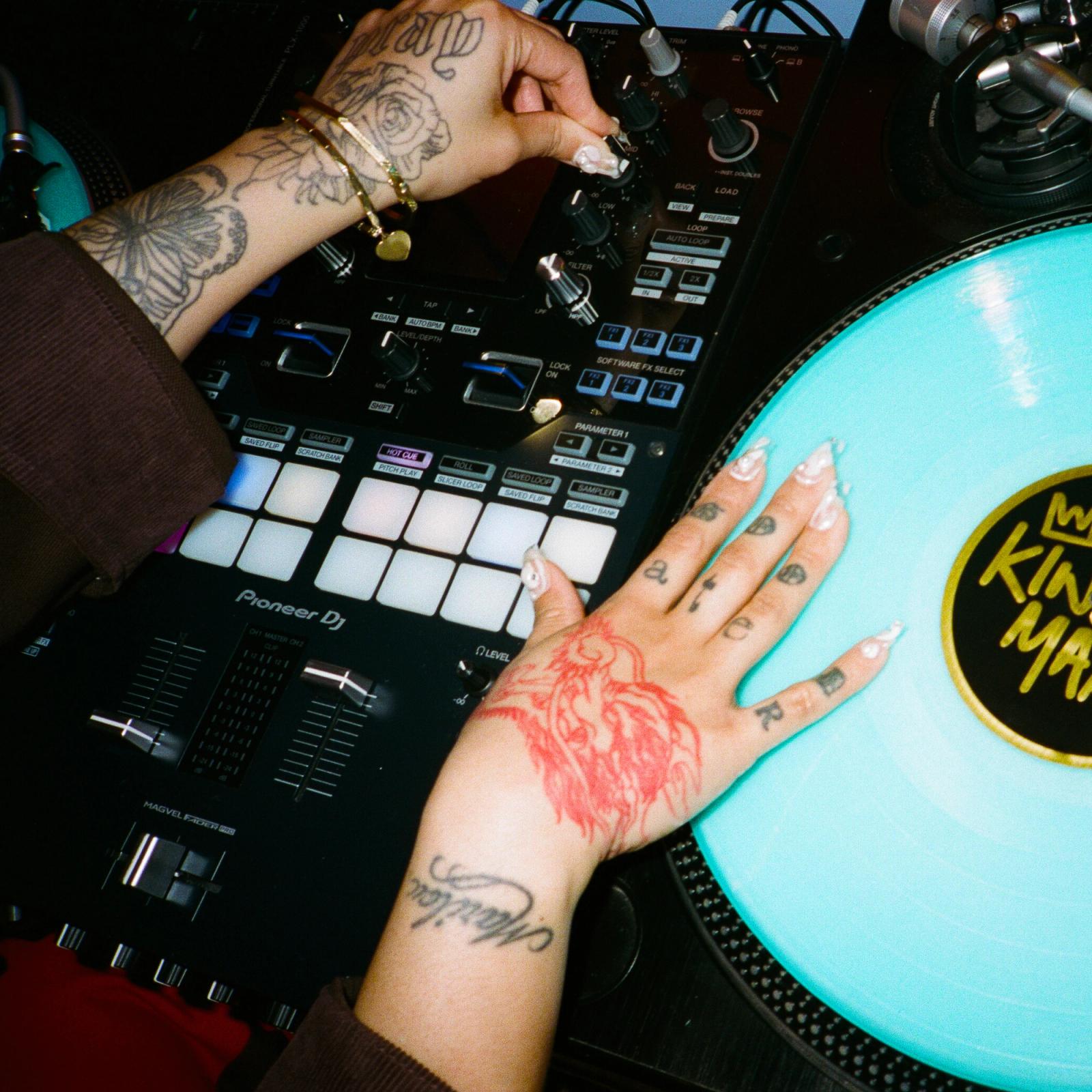 King Marie's hands on a DJ controller