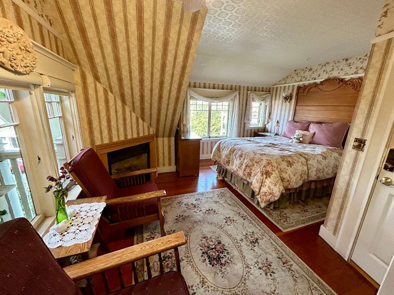 Photo of The Old St. Angela Inn - Whale Watch Room, queen size bed, sitting area, fireplace, private balcony
