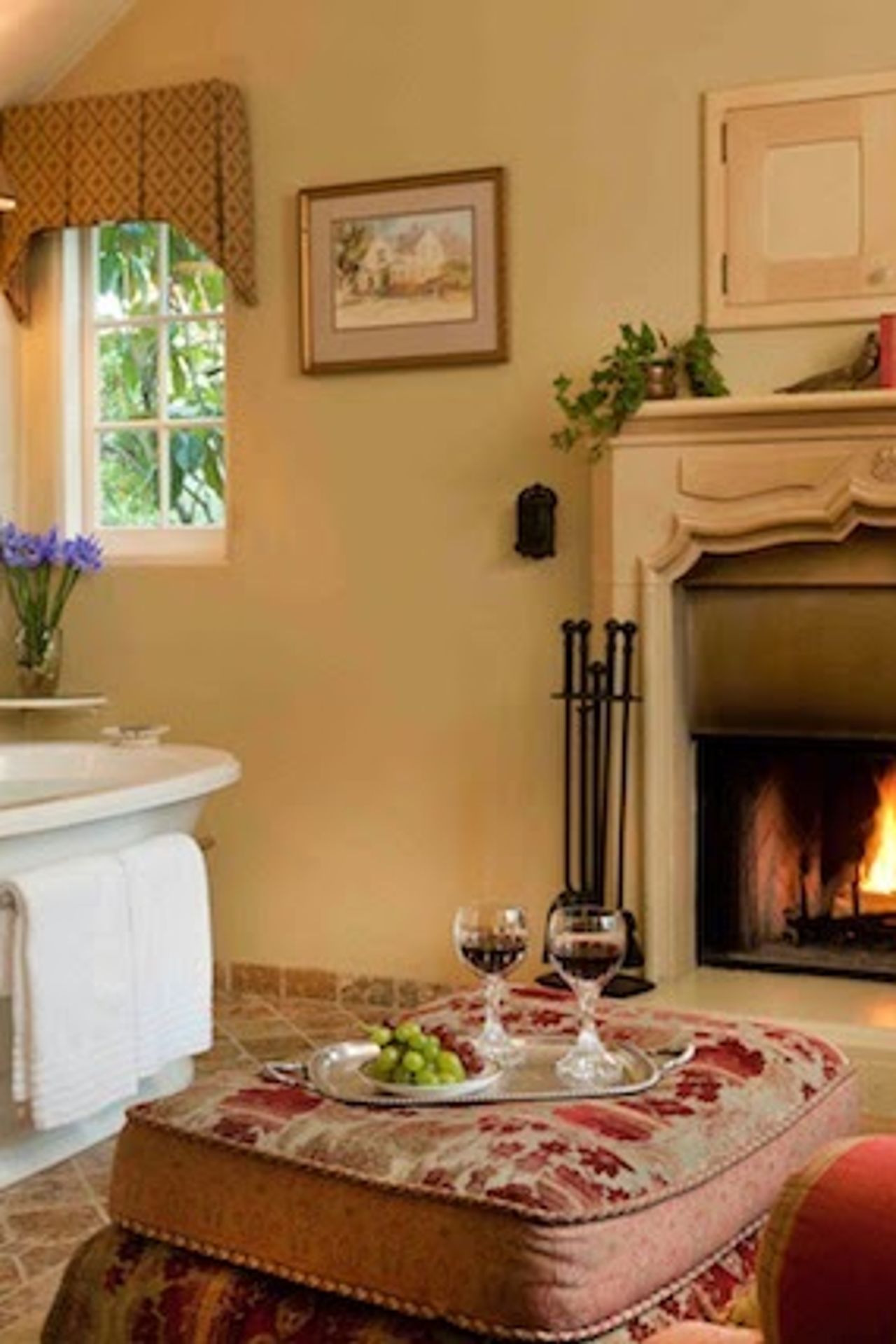 Photo of Old Monterey Inn - Brighstone Suite, Jacuzzi Bathtub in room, Sitting area by the fireplace