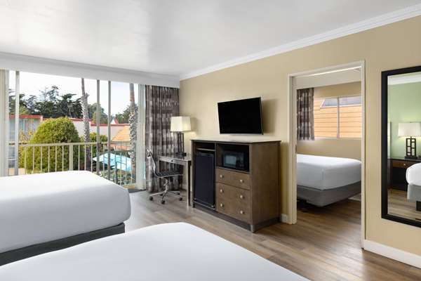 Photo of Travelodge by Wyndham Monterey Bay - Suite, 3 Queen Beds, Private Balcony, Flat TV, Work Desk, Fridge, Microwave, Coffee/Tea Maker