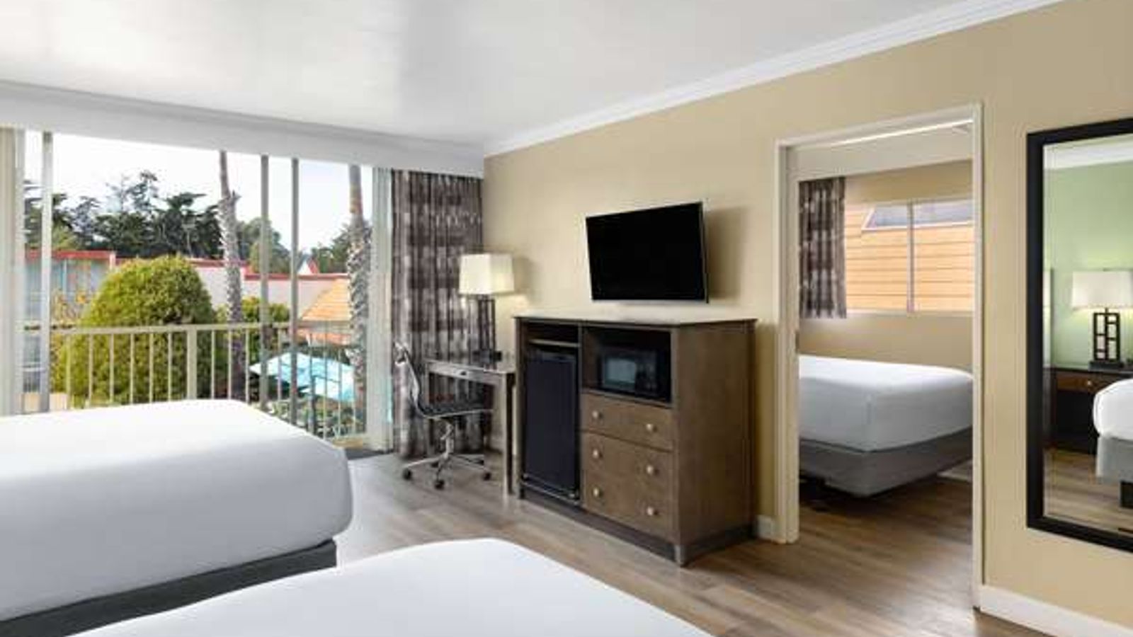 Photo of Travelodge by Wyndham Monterey Bay - Suite, 3 Queen Beds, Private Balcony, Flat TV, Work Desk, Fridge, Microwave, Coffee/Tea Maker