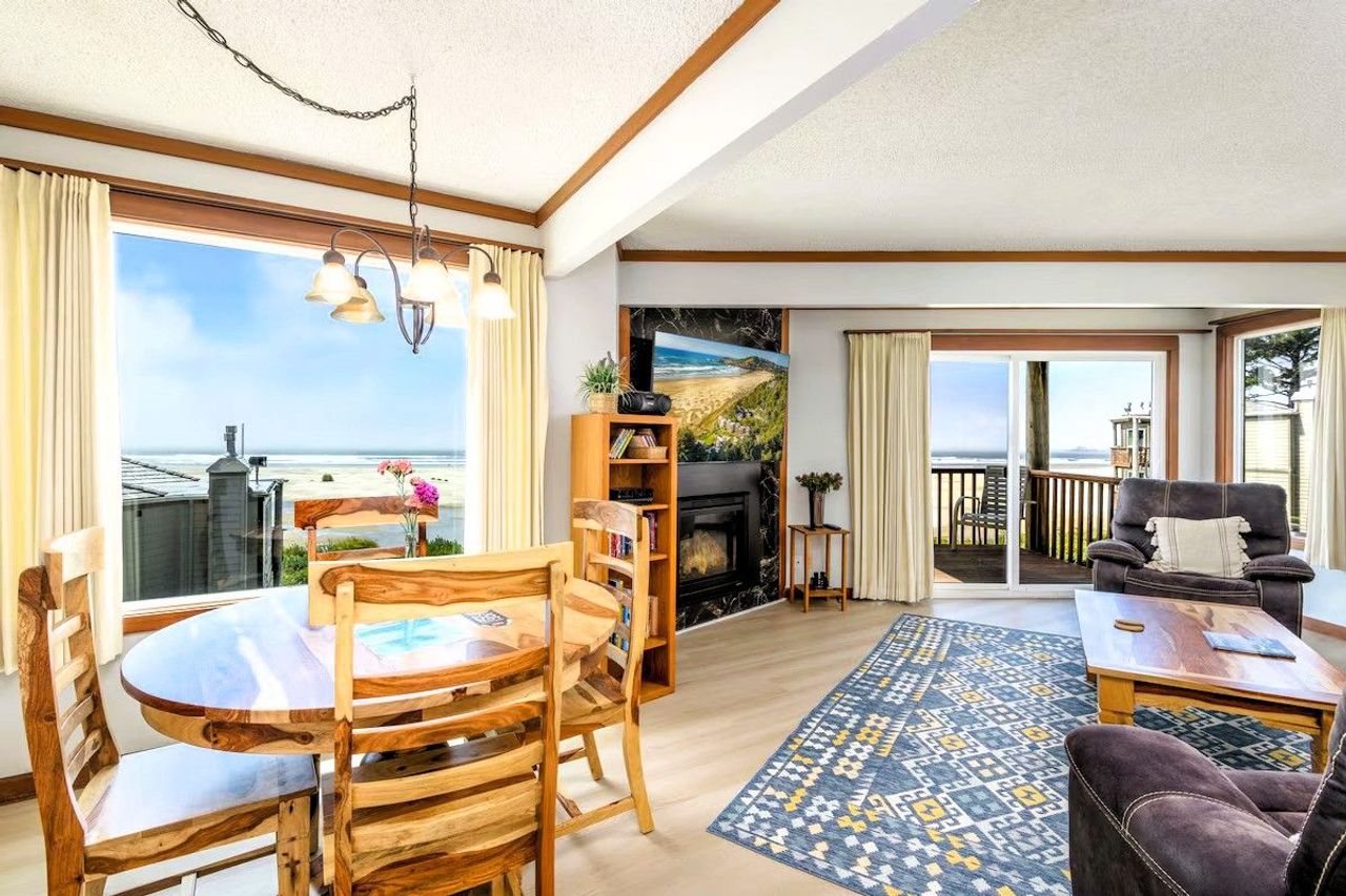 Photo of Little Creek Cove Beach Resort - Suite, Living area, Dining table, Fireplace, Terrace, Ocean Views