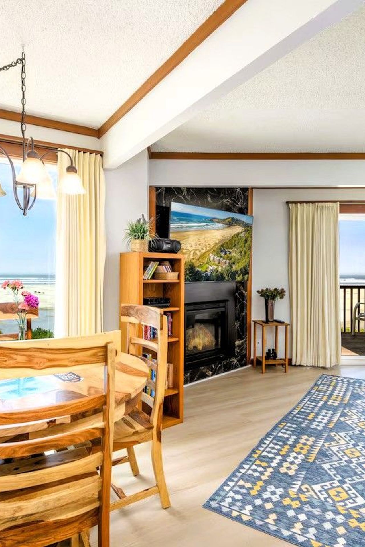 Photo of Little Creek Cove Beach Resort - Suite, Living area, Dining table, Fireplace, Terrace, Ocean Views