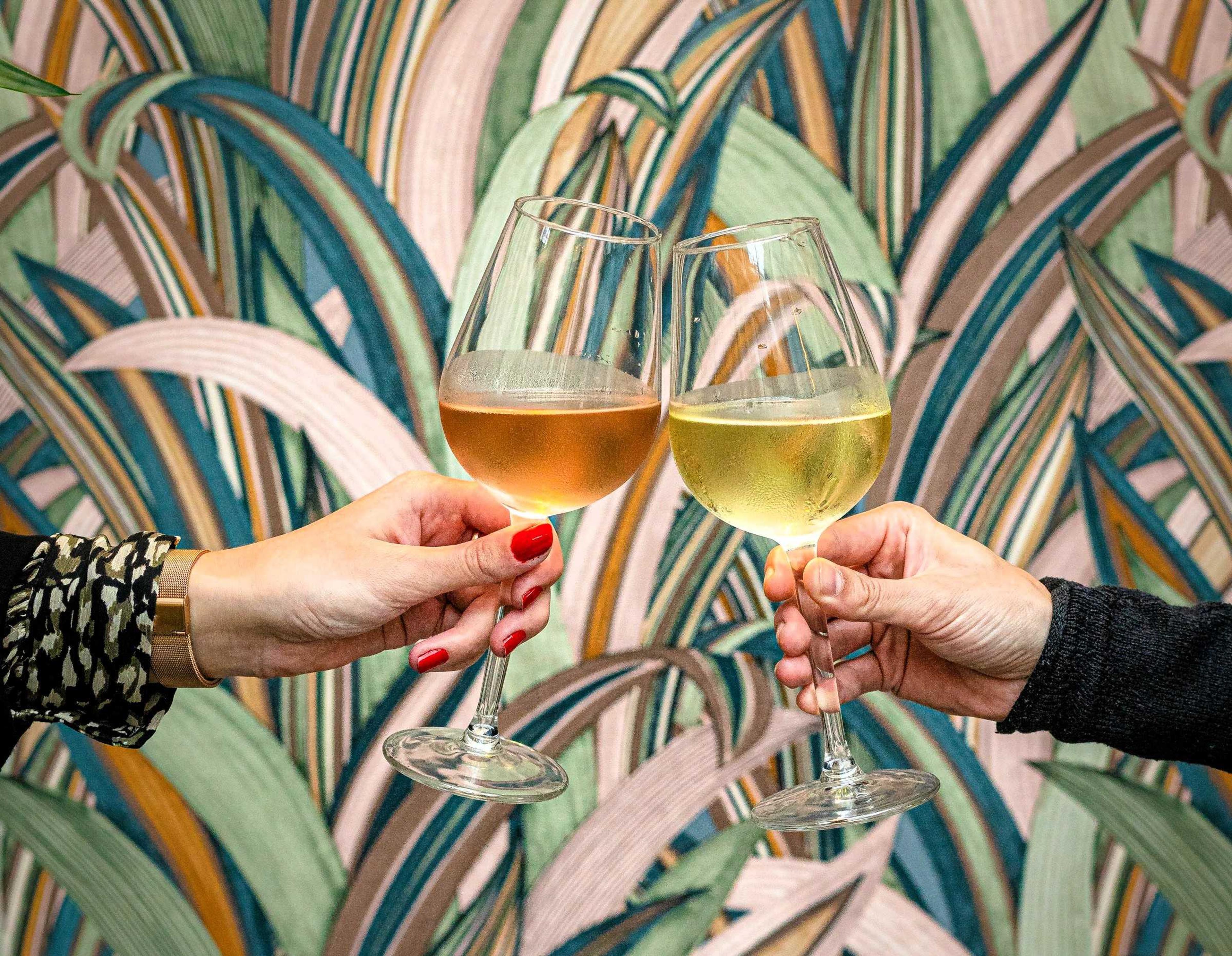 A couple toasting with zinfandel rose wine