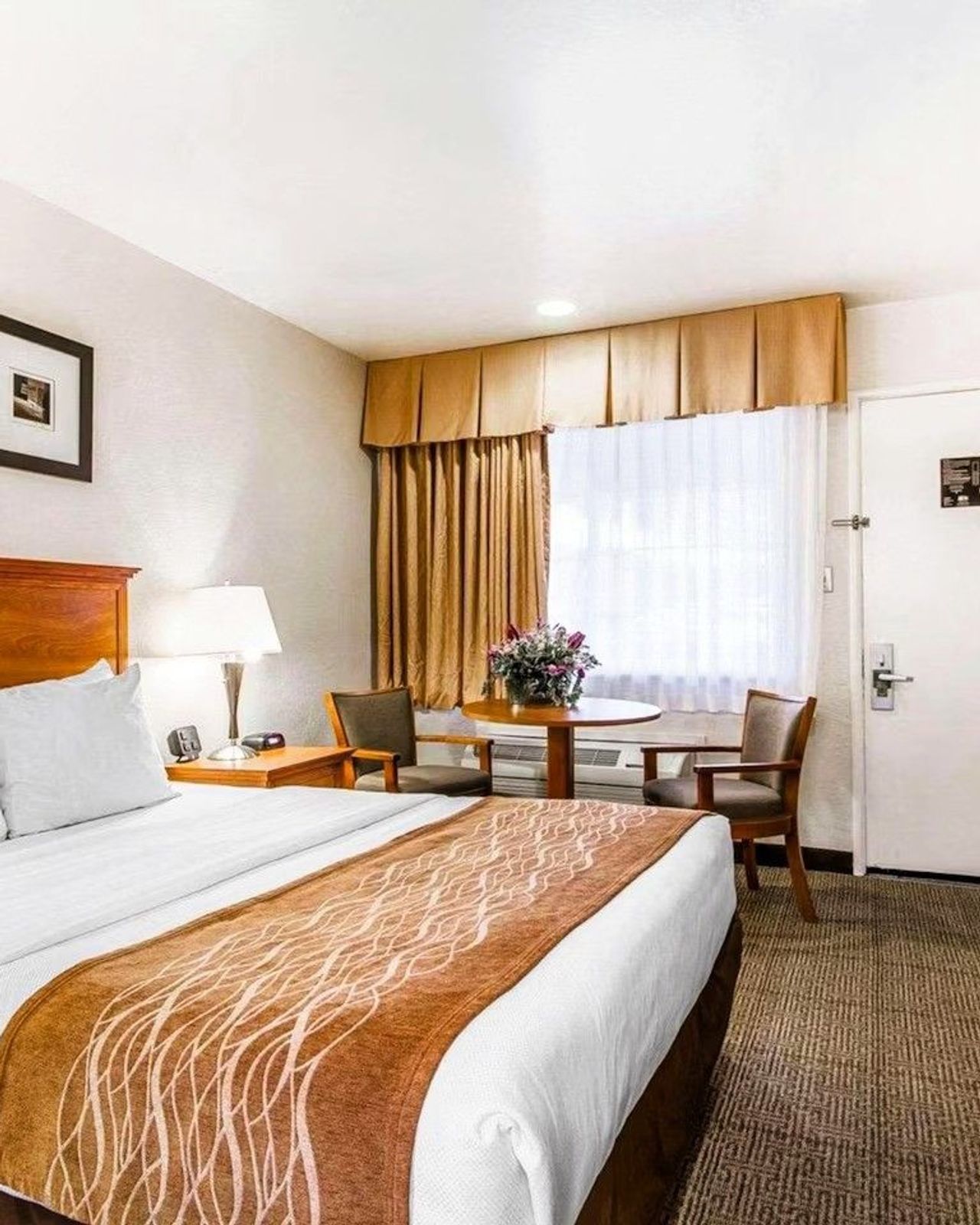 Photo of The Inn at 1252 Monterey - King Bed Room, table and chairs