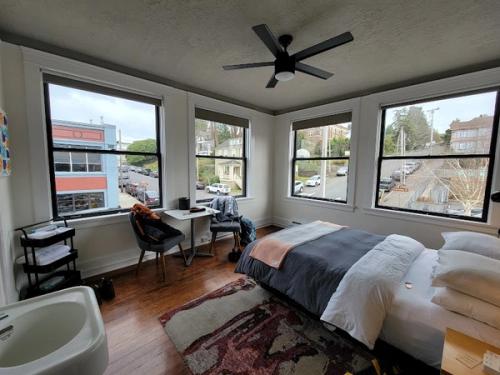 Photo of Norblad Hotel - Cabin Room, a queen bed, pillow-top mattress, an apron sink - with fresh towels, a table and chairs, and complimentary WiFi