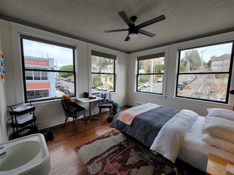 Photo of Norblad Hotel - Cabin Room, a queen bed, pillow-top mattress, an apron sink - with fresh towels, a table and chairs, and complimentary WiFi
