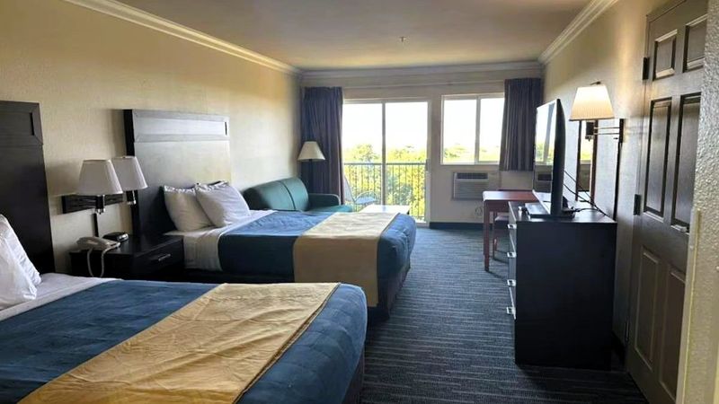 Photo of Ocean Paradise Hotel & Resort - Room, 2 queen beds, private balcony, flat tv, seating area