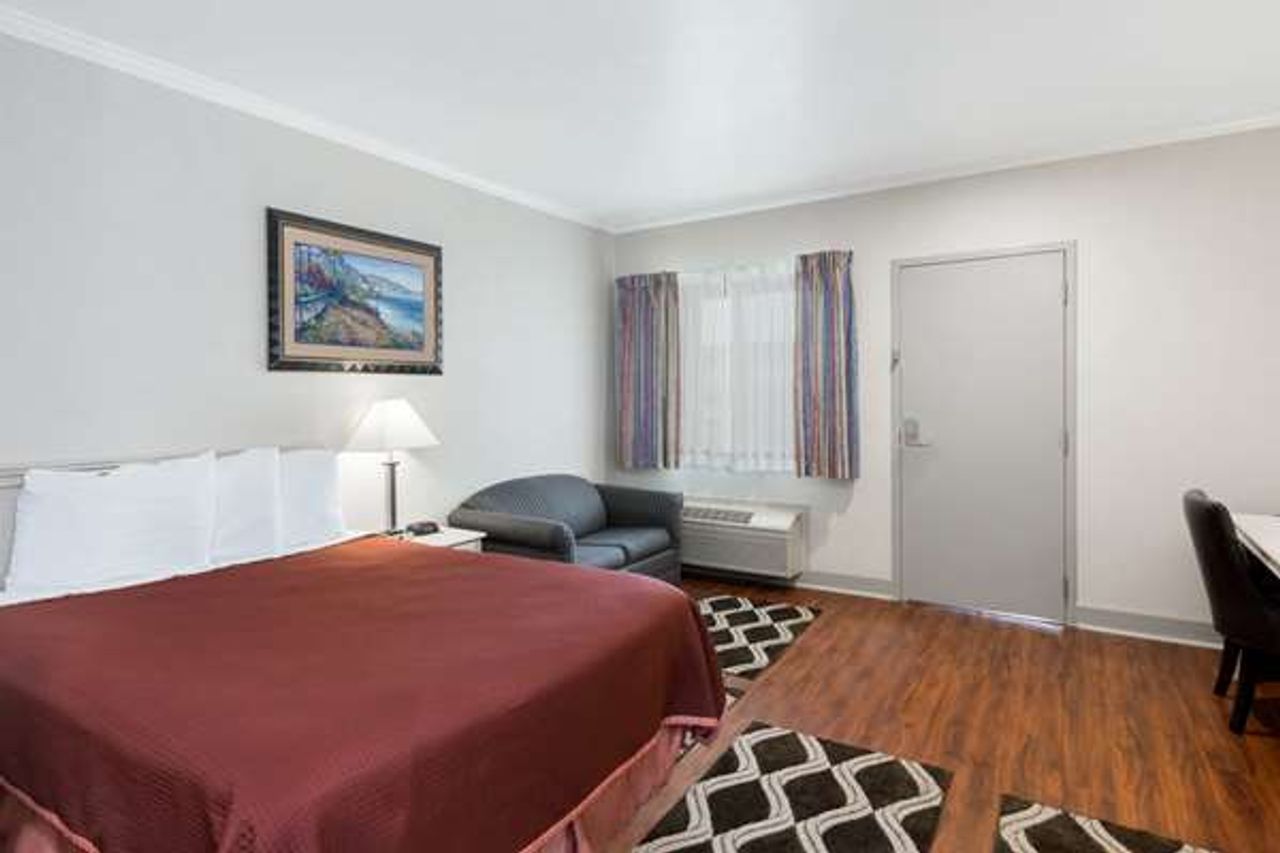 Photo of Monarch Valley Inn Marina at Monterey Bay - Room, King Bed, Sofa, Work desc