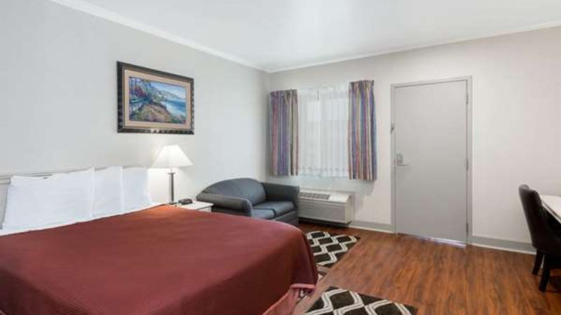 Photo of Monarch Valley Inn Marina at Monterey Bay - Room, King Bed, Sofa, Work desc