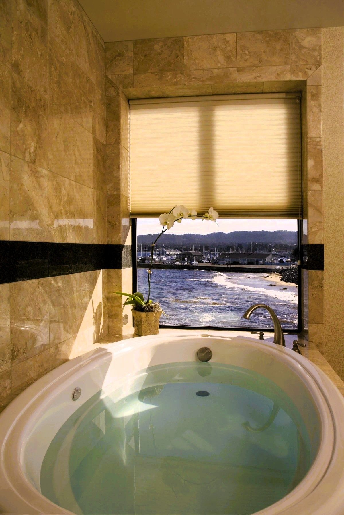 Photo of Monterey Bay Inn - Two-person jetted tub with ocean views