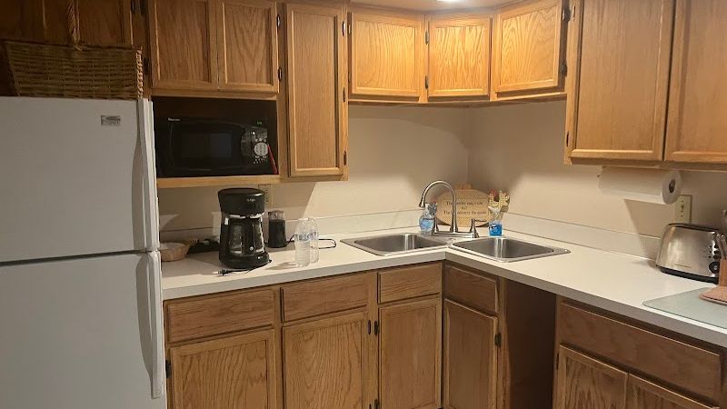 Photo of Almost Paradise Lodging at Mt. Rainier - Sunrise Guest House, Kitchen — well equipped with microwave, refrigerator, range, coffee maker/grinder, toaster, dishes, utensils, pots, coffee beans, tea