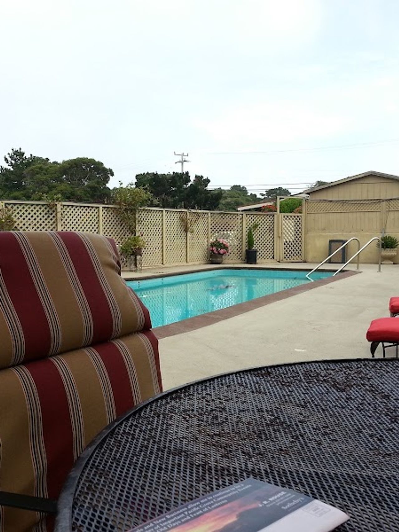 Photo of Monterey Peninsula Inn - Outdoor Pool, Seating area, Sun lounges