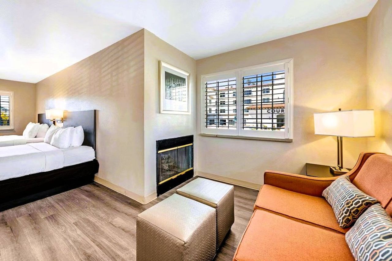 Comfort Inn Beach/Boardwalk Area - Suites with 2 Queen Beds, Seating Area, and a Fireplace