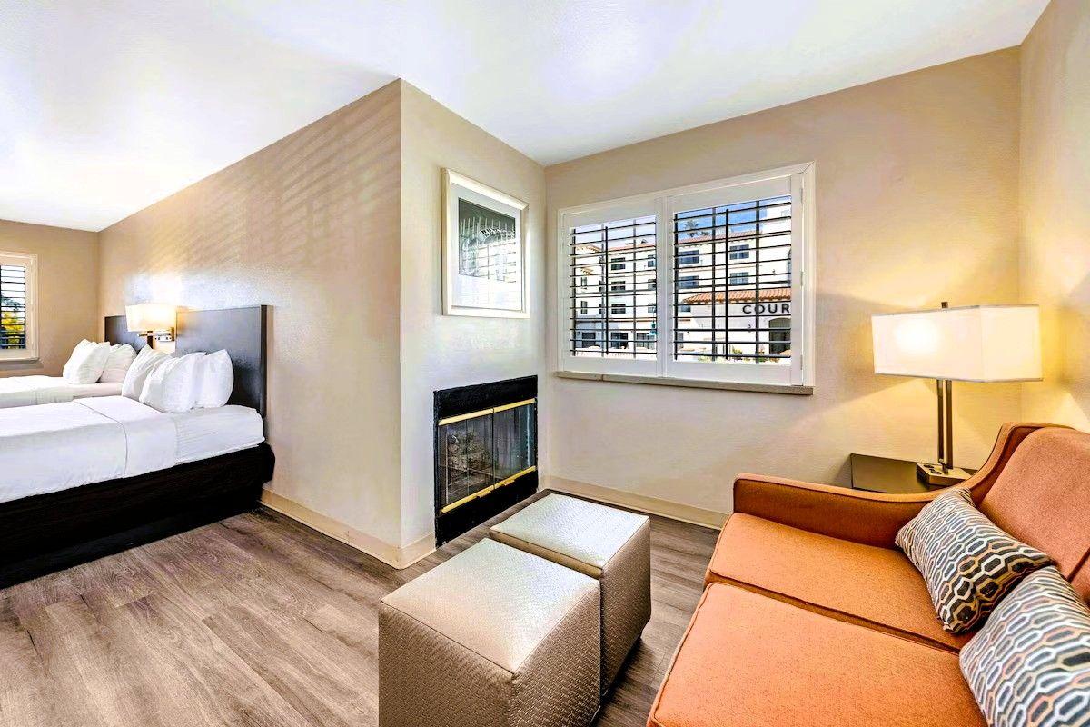 Comfort Inn Beach/Boardwalk Area - Suites with 2 Queen Beds, Seating Area, and a Fireplace