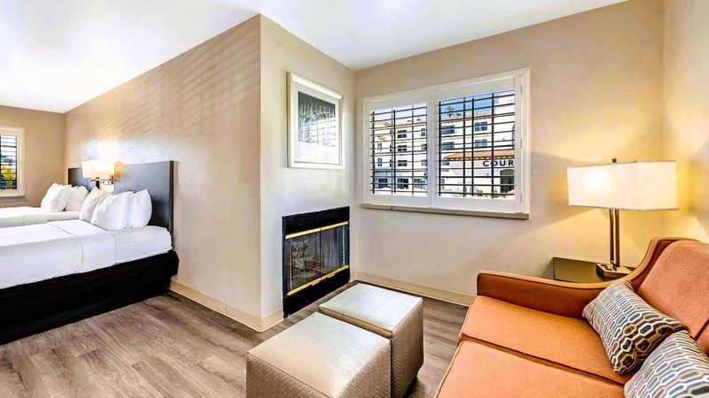 Comfort Inn Beach/Boardwalk Area - Suites with 2 Queen Beds, Seating Area, and a Fireplace