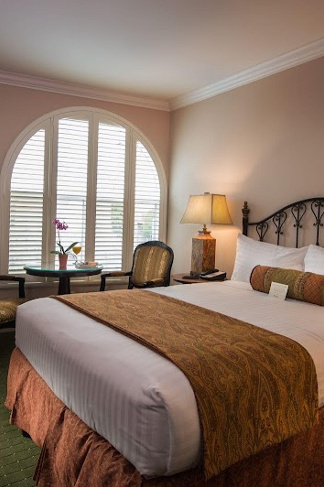 Photo of The Monterey Hotel - Deluxe Queen Room, Fireplace, Chairs and Table