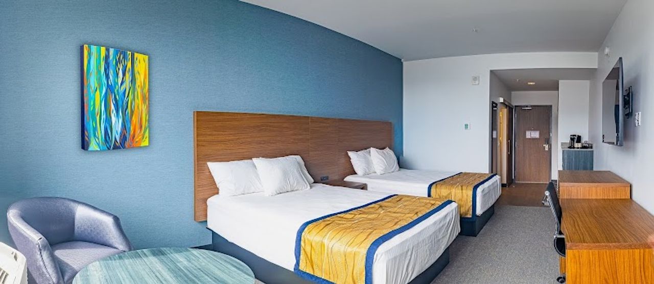 Photo of Hayward Inn - Room, 2 Queen Beds, Seating area, Flat TV