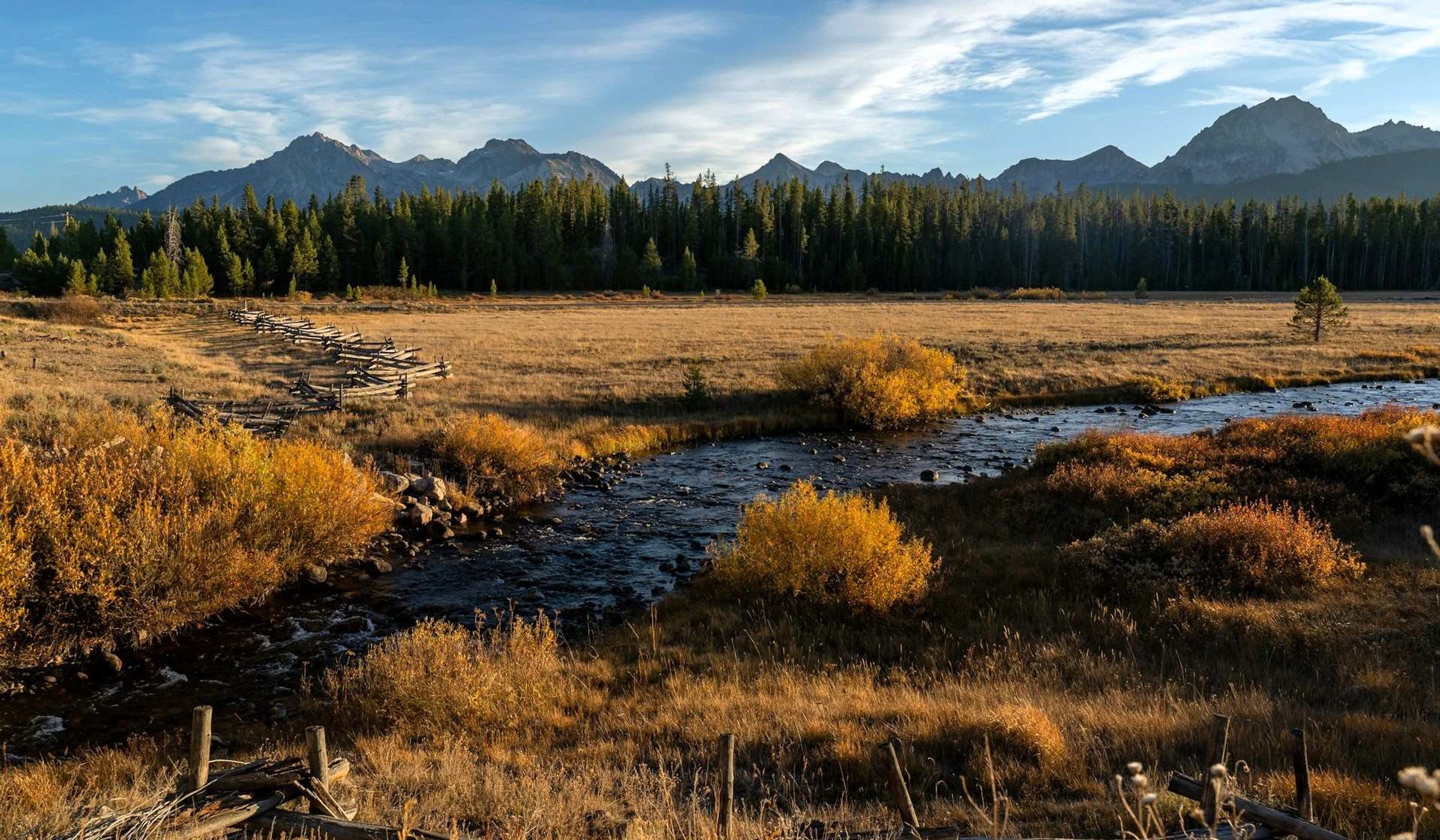 A stream running through a dry grass field in Idaho, USA