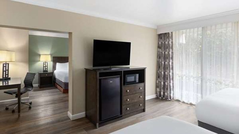 Photo of Travelodge by Wyndham Monterey Bay - Suite, 3 Queen Beds, Flat TV, Fridge, Microwave, Private balcony, Large windows